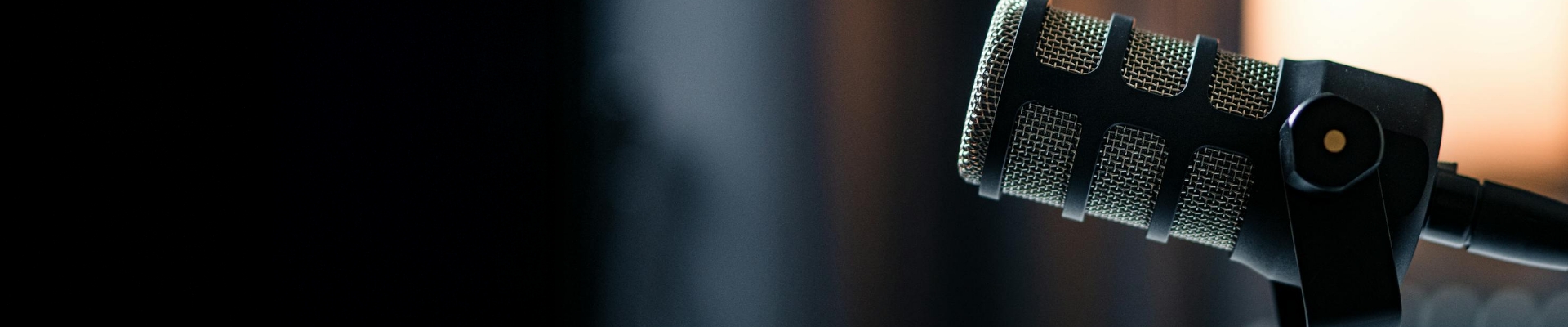 A microphone set against a dark background